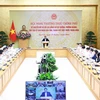 越南政府总理范明政主持召开数字化转型会议。图自越通社