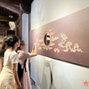 公众参观“进士碑上的龙形象”专题展览。图自qdnd.vn