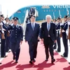 State President Luong Cuong (C) is welcomed at the Arturo M. Benitez International Airport. (Photo: VNA)