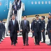 State President Luong Cuong (C) arrives at the Jorge Chavez International Airport in Lima on November 12 afternoon (local time), beginning his official visit to Peru and attendance at the 2024 APEC Economic Leaders’ Week (AELW) at the invitation of Peruvian President Dina Ercilia Boluarte Zegarra. (Photo: VNA)