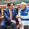 Le Premier ministre vietnamien Pham Minh Chinh (gauche) rencontre son homologue indien Narendra Modi à Vientiane. Photo: VNA