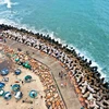 La plage rocheuse d'Ong Dia est en train de devenir une destination préférée des jeunes, notamment des passionnés de photographie. Photo: VNA