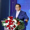 越南政府总理范明政在会议上发言。图自越通社
