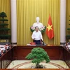越南国家主席苏林在会议上发表讲话。图自越通社