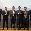 与会代表合影。图自越通社