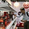 A consumer visit a booth at the Vietnam International Cafe' Show 2024. (Photo: VNA)