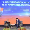 Narayana Murthy talks with FPT Chairman Truong Gia Binh during their conversation in Hoa Lac High Tech Park. (Photo: VNA) 