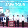 Representatives from agencies are at the launching ceremony of the app "Sapa Tour" to promote tourism in resort town of Sa Pa in northern province of Lao Cai. (Photo: nhandan.vn)