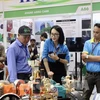 People are at a display booth at the Agri Vietnam 2024. (Photo: VNA)