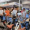 People at a bike exhibition. (Photo: VNA)