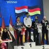 Bao Phuong Vinh (standing on the left on the podium) celebrates winning the runner-up place of the Ankara World Cup three-cushion event in Turkey on June 15. ( Photo: nld.com.vn) 
