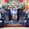 President To Lam (R) receives President of the National Assembly (NA) of People's Power of Cuba Esteban Lazo Hernandez in Hanoi on July 24. (Photo: VNA)