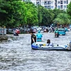 Floodwater still inundates Hanoi streets at noon on July 24. (Photo: VNA)