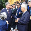 Party General Secretary and President To Lam meets with overseas Vietnamese in Hanoi on August 23. (Photo: VNA)