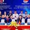 The youth unions of Quang Tri province and three Lao provinces - Savannakhet, Salavan and Sekong- sign a joint message of the friendship programme on August 28. (Photo: VNA)