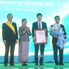 The Cambodia Royal Order of Monisaraphon, the highest order of the Cambodian Royal Family, is awarded to the BIDC at the ceremony. (Photo: VNA)