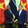 Prime Minister Pham Minh Chinh (R) meets with Mozambican President Filipe Jacinto Nyusi in Hanoi on September 9. (Photo: VNA)