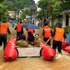 People are evacuated from flooded areas in the northern province of Ha Giang. (Photo: VNA)