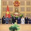 Prime Minister Pham Minh Chinh receives a delegation of ASEAN BAC chairmen led by ASEAN BAC Chair 2024 and President of the Lao Chamber of Commerce and Industry Oudet Souvannavong in Hanoi on September 13. (Photo: VNA)