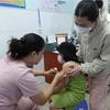 A child in Ho Chi Minh City gets vaccinated against measles. (Photo: VNA)