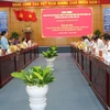 At the meeting between the delegation of officials of the Lao People's Revolutionary Party (LPRP) and representatives of the Mekong Delta province of Long An. (Photo: VNA)