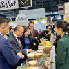 Vietnamese Ambassador to France Dinh Toan Thang visits Vietnamese booth at SIAL Paris 2024. (Photo: VNA)