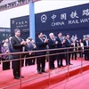 Prime Minister Pham Minh Chinh (third from left) and Vietnamese and Chinese officials welcome an ASEAN fast train from Hanoi to the Chongqing International Logistics Hub Park on November 8. (Photo: VNA)