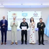 A police officer receives a certificate after attending the training programme in Hanoi. (Photo: VNA)