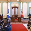 Vietnamese Prime Minister Pham Minh Chinh (standing, left) and President of the Dominican Republic Luis Abinader Corona chair a joint press conference on November 20 morning (local time) after their talks. (Photo: VNA)