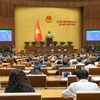 The 15th National Assembly (NA) adopts the Law on amendments and supplementations to a number of articles of nine laws on November 29. (Photo: quochoi.vn)