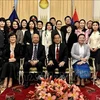 Vietnamese Ambassador to France Dinh Toan Thang (front, second from left), his Lao counterpart Kham-Inh Khitchadeth (front, second from right), and other diplomats at the meeting. (Photo: VNA)