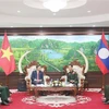 Lao Minister of National Defence Khamlieng Uthakaysone receives a delegation of the Vietnamese Embassy in Laos led by Ambassador Nguyen Minh Tam. (Photo: VNA)