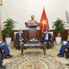 Deputy Prime Minister and Minister of Foreign Affairs Bui Thanh Son (R) on December 6 receives Azerbaijani Ambassador to Vietnam Shovgi Kamal Oglu Mehdizade. (Photo: baochinhphu.vn)