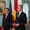 Secretary of the Party Central Committee and Chairman of its Commission for External Relations Le Hoai Trung (left) and US Secretary of State Antony Blinken. (Photo: VNA)