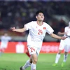 Vietnamese player Nguyen Hai Long (24) celebrates his opener in the match against Laos. (Photo: VNA)