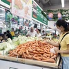 Customers shop at a supermarket in HCM City. (Photo: VNA)
