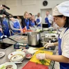 Vietnamese chefs show participants how to prepare, process, and enjoy Pho, and its meaning. (Photo: VNA)