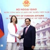 Minister of Foreign Affairs Bui Thanh Son shakes hands with Deputy Prime Minister and Minister of Foreign and European Affairs of Slovenia Tanja Fajon (Photo: VNA)