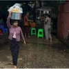 Nine people from a "squatter ward" in Yangon were hospitalised for severe diarrhoea. (Photo: AFP)