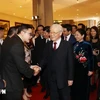 General Secretary and President Nguyen Phu Trong and his wife meet overseas Vietnamese returned home to celebrate Tet and attend the 2019 Homeland Spring programme in 2019 (Photo: VNA)