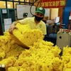 Processing rubber for export at Phu Rieng Company's factory. (Photo: VNA)