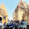 Visitors at the Ponagar Cham Tower (Photo: VNA)