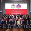 Participants pose for a group photo at the meeting (Photo: VNA)