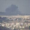 Smoke rises after an Israeli airstrike on Qantara, Lebanon on September 22, 2024. (Photo: Xinhua/VNA)