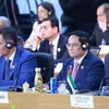 Prime Minister Pham Minh Chinh (R) attends the G20 Summit in Rio de Janeiro. (Photo: VNA)