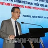 Vu Nhu Thang, Acting Vice Chairman of the National Financial Supervisory Commission, speaks at the conference. (Photo: VNA)