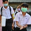 Illustrative image. Students wash your hands before entering class at a school in Bangkok, Thailand. (Photo: VNA)