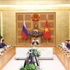 El viceprimer ministro vietnamita Tran Hong Ha y su homólogo ruso, Dmitry Chernyshenko, copresiden la reunión. (Fuente: VNA)