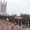 乂安省为在老挝牺牲的87位越南志愿军和专家烈士举行追悼会 。图自越通社