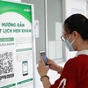 在胡志明市皮肤科医院人们扫描二维码进行预约挂号图自越通社